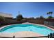 Inviting swimming pool surrounded by lush landscaping and a privacy fence for outdoor enjoyment at 3897 E Douglas Loop, Gilbert, AZ 85234