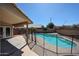 Sparkling pool with safety fence, surrounded by a patio, perfect for summer fun and relaxation at 3897 E Douglas Loop, Gilbert, AZ 85234