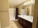 Double sink vanity with tile floor and shower/tub combo in this bathroom at 4332 E Oakland St, Gilbert, AZ 85295