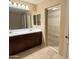 Bathroom boasting a double sink vanity, sliding door to the walk-in closet at 4332 E Oakland St, Gilbert, AZ 85295