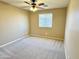 Neutral bedroom with carpet, ceiling fan, and a window with blinds for a comfortable atmosphere at 4332 E Oakland St, Gilbert, AZ 85295