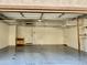 Spacious garage with a clean, epoxy floor offering ample storage and parking space for vehicles and equipment at 4332 E Oakland St, Gilbert, AZ 85295