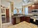 Open kitchen showcases a breakfast bar, stainless steel appliances, and granite countertops at 4332 E Oakland St, Gilbert, AZ 85295