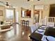 Open-concept living room with a dining area, leading to the kitchen and backyard at 4332 E Oakland St, Gilbert, AZ 85295