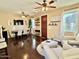 Spacious living room offers comfortable seating, a TV, and access to the dining area at 4332 E Oakland St, Gilbert, AZ 85295