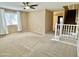 Inviting living room with cozy carpet, stairway, and a large window for plenty of light at 4332 E Oakland St, Gilbert, AZ 85295