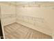 Spacious walk-in closet with carpeted floor and shelving for organized storage solutions at 4332 E Oakland St, Gilbert, AZ 85295
