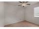 Bedroom featuring light wood floors, a ceiling fan, and lots of natural light at 4644 W Havasupai Dr, Glendale, AZ 85308