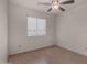 Bedroom featuring light wood floors, a ceiling fan, and a window with blinds at 4644 W Havasupai Dr, Glendale, AZ 85308