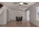 Light-filled living room featuring wood floors, ceiling fan and sliding door to the outside at 4644 W Havasupai Dr, Glendale, AZ 85308
