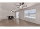 Open living space with light wood floors, dining table, and sliding glass door at 4644 W Havasupai Dr, Glendale, AZ 85308