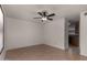 Bright living room with light wood floors and views into the kitchen area at 4644 W Havasupai Dr, Glendale, AZ 85308