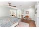 Bright bedroom with a cozy window seat, hardwood floors, and a decorative rug at 4710 N 33Rd Pl, Phoenix, AZ 85018