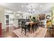 Elegant dining room with hardwood floors, stylish lighting, and easy access to the kitchen and living room, ideal for gatherings at 4710 N 33Rd Pl, Phoenix, AZ 85018