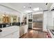 Bright kitchen with a stainless steel refrigerator, breakfast bar, and wine storage; open layout to living spaces at 4710 N 33Rd Pl, Phoenix, AZ 85018