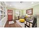 Inviting living room featuring hardwood floors, bright paint and a red front door at 4710 N 33Rd Pl, Phoenix, AZ 85018