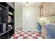 An office with built-in cabinets. A washer and dryer hook up is visible at 4710 N 33Rd Pl, Phoenix, AZ 85018