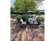 Outdoor patio featuring brick paving, comfortable seating, and a lush garden backdrop at 4710 N 33Rd Pl, Phoenix, AZ 85018