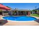 Backyard features a sparkling pool, covered patio, and ample space for outdoor entertaining at 4710 N 33Rd Pl, Phoenix, AZ 85018