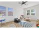 ' bedroom with ample natural light, wooden floors, playful decor, and cozy beanbag seating at 5650 S Feliz --, Mesa, AZ 85212