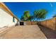 Large backyard with a storage shed, providing ample space for outdoor activities and storage at 5654 W Vineyard Rd, Laveen, AZ 85339