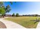 Expansive grassy park area surrounded by houses, offering a serene and recreational space at 5654 W Vineyard Rd, Laveen, AZ 85339