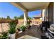 Spacious covered patio overlooking the backyard, perfect for outdoor entertaining or relaxation at 5654 W Vineyard Rd, Laveen, AZ 85339