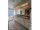 Bathroom showcasing granite countertops, double sinks, tile flooring, and a walk-in shower at 6407 W Madras Ln, Glendale, AZ 85306