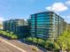 Striking aerial view of luxury high-rise condominiums with vibrant landscaping and city streets at 7180 E Kierland Blvd # 507, Scottsdale, AZ 85254