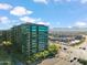 Scenic aerial of modern condominiums and city, showcasing upscale living with mountain views at 7180 E Kierland Blvd # 507, Scottsdale, AZ 85254