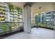 Private balcony with greenery, iron railings, and a view of the building's architecture at 7180 E Kierland Blvd # 507, Scottsdale, AZ 85254