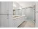 Modern bathroom with granite countertop, double sinks, and a glass-enclosed shower at 7180 E Kierland Blvd # 507, Scottsdale, AZ 85254