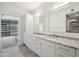 Bright bathroom with granite countertop, double sinks, and contemporary fixtures at 7180 E Kierland Blvd # 507, Scottsdale, AZ 85254