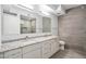 Contemporary bathroom with granite countertop, double sinks, and modern tile work at 7180 E Kierland Blvd # 507, Scottsdale, AZ 85254