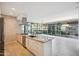 Modern kitchen with stainless steel appliances, granite counters, and large windows with lush exterior views at 7180 E Kierland Blvd # 507, Scottsdale, AZ 85254