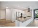 Modern kitchen with white cabinets, stainless steel appliances, granite countertops, and an open layout at 7180 E Kierland Blvd # 507, Scottsdale, AZ 85254