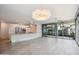 Spacious open-concept living area featuring a modern kitchen, tile flooring, and balcony access with views at 7180 E Kierland Blvd # 507, Scottsdale, AZ 85254