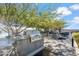 Modern outdoor kitchen area with stainless steel grill, countertop space, and mature trees offering shade at 7180 E Kierland Blvd # 507, Scottsdale, AZ 85254