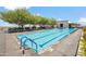 Stunning swimming pool featuring lounge chairs and mature trees in this community's outdoor recreation area at 7180 E Kierland Blvd # 507, Scottsdale, AZ 85254