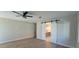Bedroom featuring a sliding barn door leading to the ensuite bathroom for added privacy and convenience at 7724 E Charter Oak Rd, Scottsdale, AZ 85260