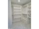 Walk-in closet with custom shelving and ample storage space, providing organization and convenience at 7724 E Charter Oak Rd, Scottsdale, AZ 85260
