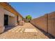 Low maintenance backyard with block wall, gravel and pavers, offering a serene and private outdoor space at 9074 W Runion Dr, Peoria, AZ 85382
