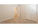 Carpeted bedroom featuring sliding closet and white walls at 9074 W Runion Dr, Peoria, AZ 85382