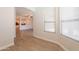 Dining room with modern lighting, laminate flooring, and arched doorway at 9074 W Runion Dr, Peoria, AZ 85382