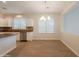 Bright dining area featuring stylish chandelier, and stainless steel dishwasher at 9074 W Runion Dr, Peoria, AZ 85382