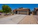 Charming single-story home with desert landscaping, a tile roof, and a spacious two-car garage at 9074 W Runion Dr, Peoria, AZ 85382
