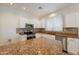 Modern kitchen with granite countertops, stainless steel appliances, and white cabinetry at 9074 W Runion Dr, Peoria, AZ 85382