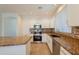Modern kitchen featuring stainless steel appliances, granite countertops, and ample cabinet space at 9074 W Runion Dr, Peoria, AZ 85382