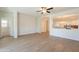 Open-concept living room with a view into the kitchen, featuring modern finishes at 9074 W Runion Dr, Peoria, AZ 85382
