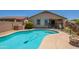 Backyard featuring a refreshing pool with easy access steps and a well-maintained patio area at 9074 W Runion Dr, Peoria, AZ 85382